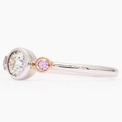 Equinox Argyle pink and white GIA-certified trilogy bezel-set diamond ring
