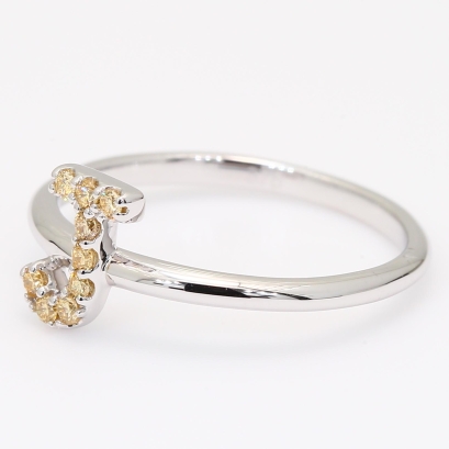 Love Letter J fancy apricot diamond ring