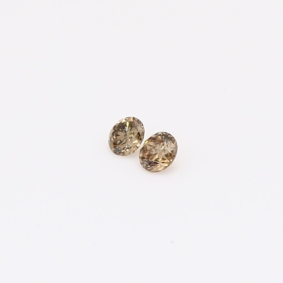 0.13 Total carat pair of round-cut champagne diamonds