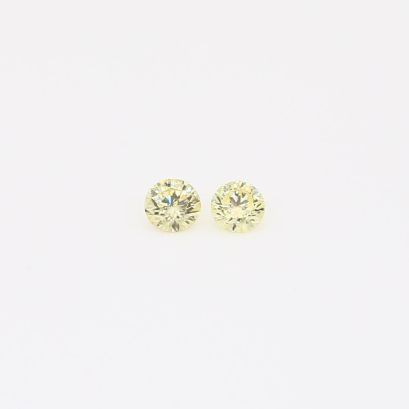 0.09 Total carat pair of round-cut fancy intense yellow diamonds