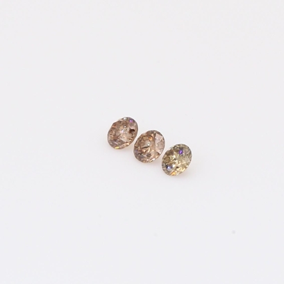 0.105 Total carat trio of round-cut champagne diamonds