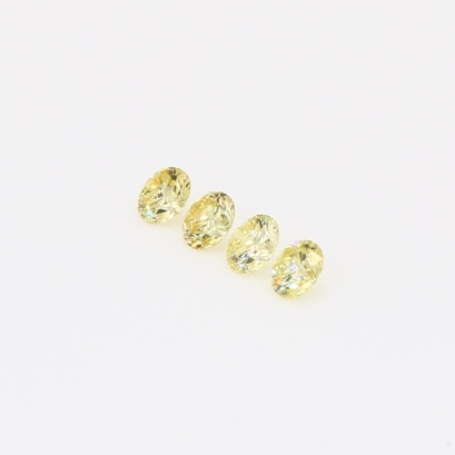 0.20 Total carat parcel of round-cut fancy yellow diamonds