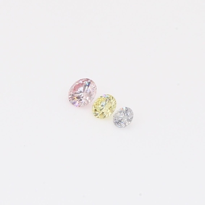 0.125 Total carat trio of round-cut rainbow diamonds