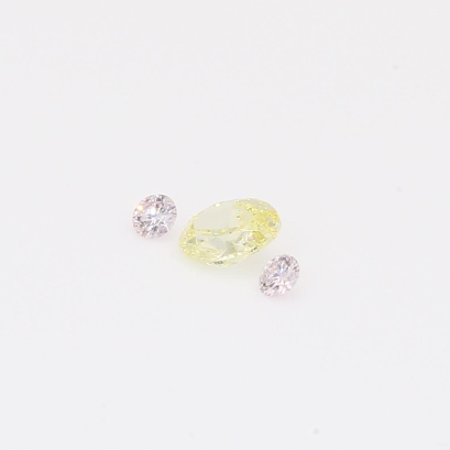 0.26 Total carat trio of round-cut Argyle fancy light pink and oval-cut fancy light yellow diamonds
