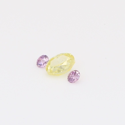 0.28 Total carat trio of round-cut purple and oval-cut fancy light yellow diamonds