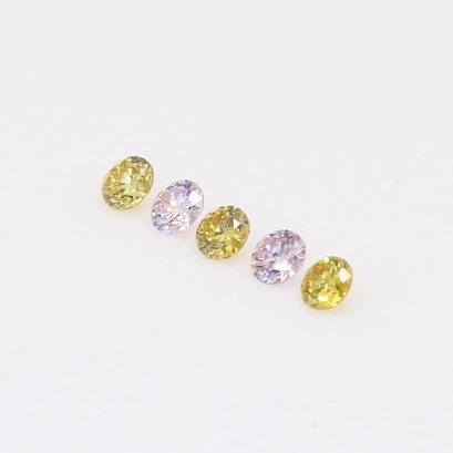 0.19 Total carat parcel of round-cut fancy purple and fancy green diamonds