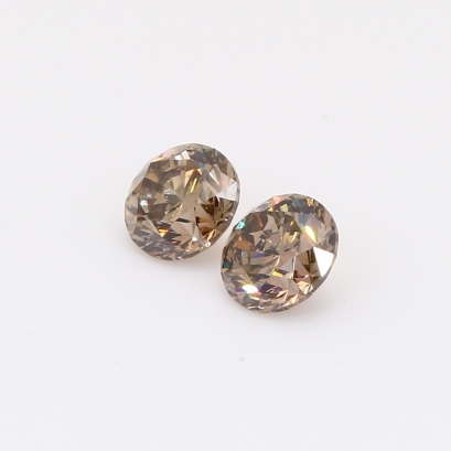 0.92 Total carat pair of brilliant-cut round champagne diamonds