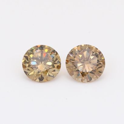 1.15 Total carat pair of brilliant-cut round champagne diamonds