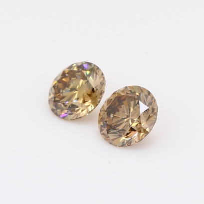 1.15 Total carat pair of brilliant-cut round champagne diamonds