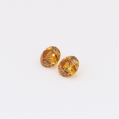 0.28 Total carat pair of brilliant-cut round fancy deep orange diamonds