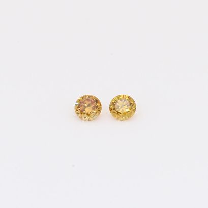0.08 Total carat pair of brilliant-cut round fancy orange diamonds