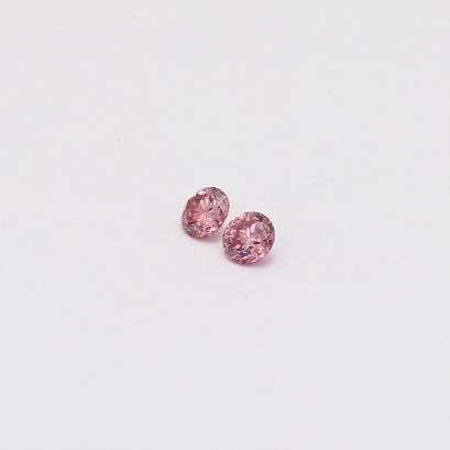0.08 Total carat pair of round-cut 4P Argyle pink diamonds