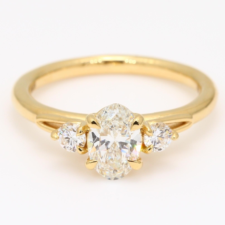 Francine oval and round-cut white diamond three-stone engagement ring