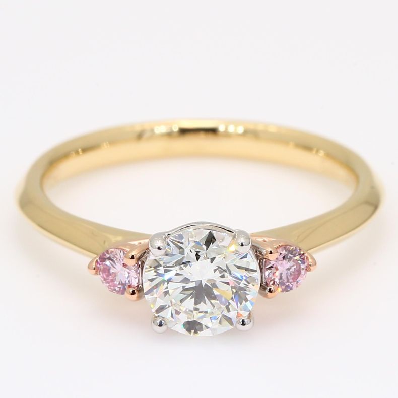 Luminous Argyle pink and white round-cut diamond three-stone engagement ring