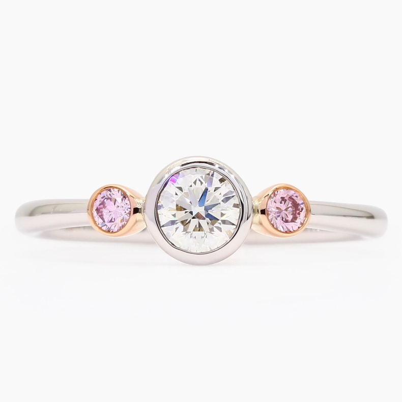 Equinox Argyle pink and white GIA-certified trilogy bezel-set diamond ring
