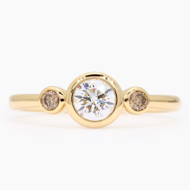 Equinox champagne and white IGI-certified trilogy bezel-set diamond ring