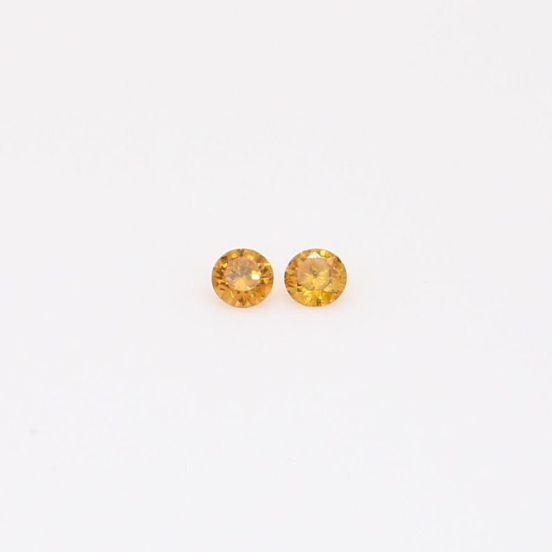 0.04 Total carat pair of round-cut fancy orange diamonds