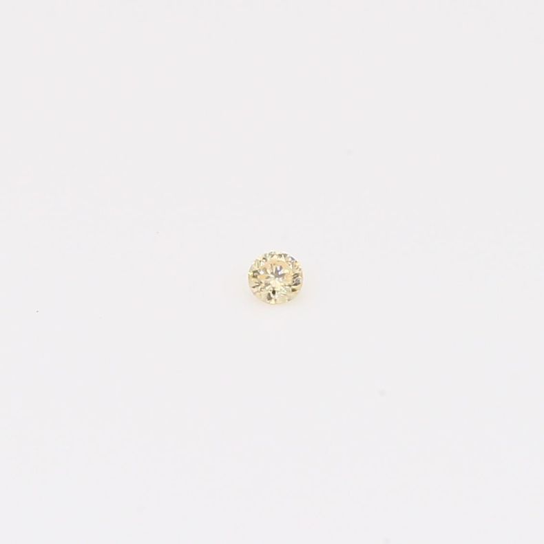0.02 Carat round-cut fancy apricot diamond
