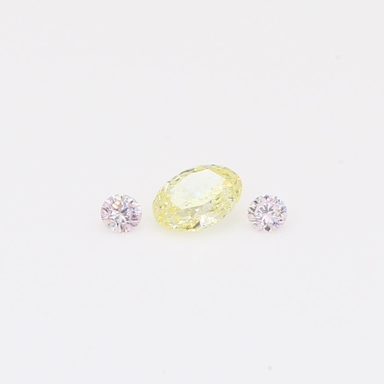 0.26 Total carat trio of round-cut Argyle fancy light pink and oval-cut fancy light yellow diamonds