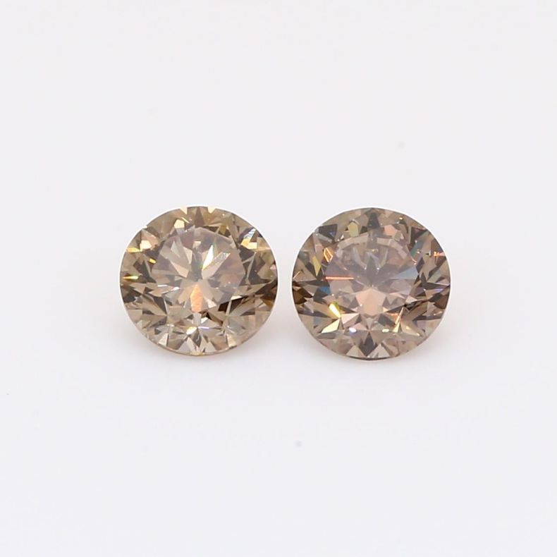 0.92 Total carat pair of brilliant-cut round champagne diamonds