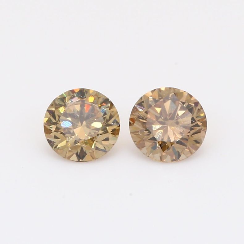 1.15 Total carat pair of brilliant-cut round champagne diamonds