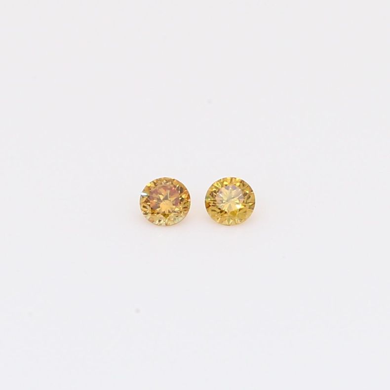 0.08 Total carat pair of brilliant-cut round fancy orange diamonds