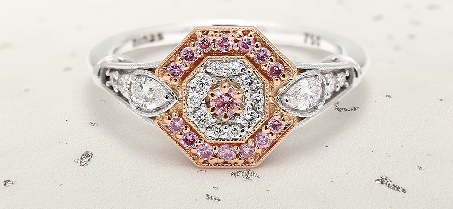 Finished The Meg ring featuring a central pink diamond, pink diamond halo and white diamonds