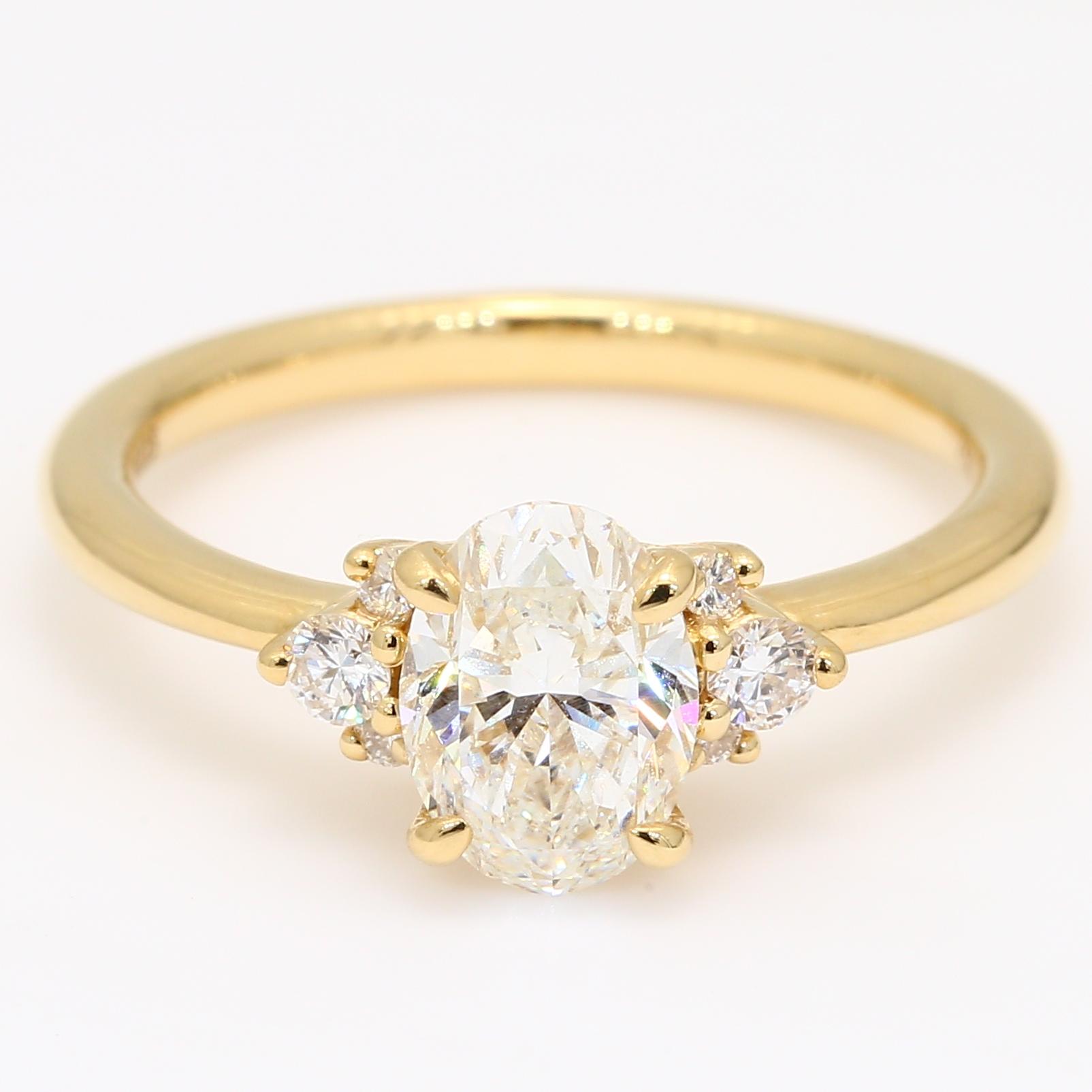 Deserie oval and round-cut white diamond engagement ring