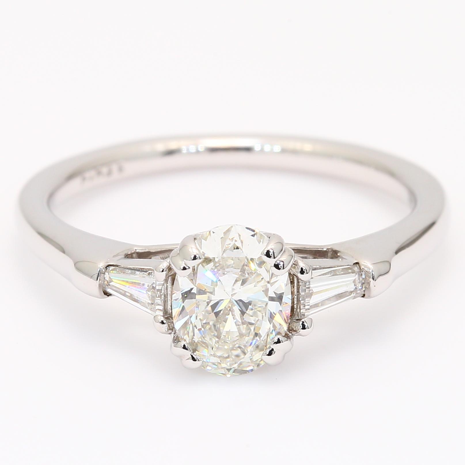Daria oval and tapered baguette-cut white diamond three-stone engagement ring
