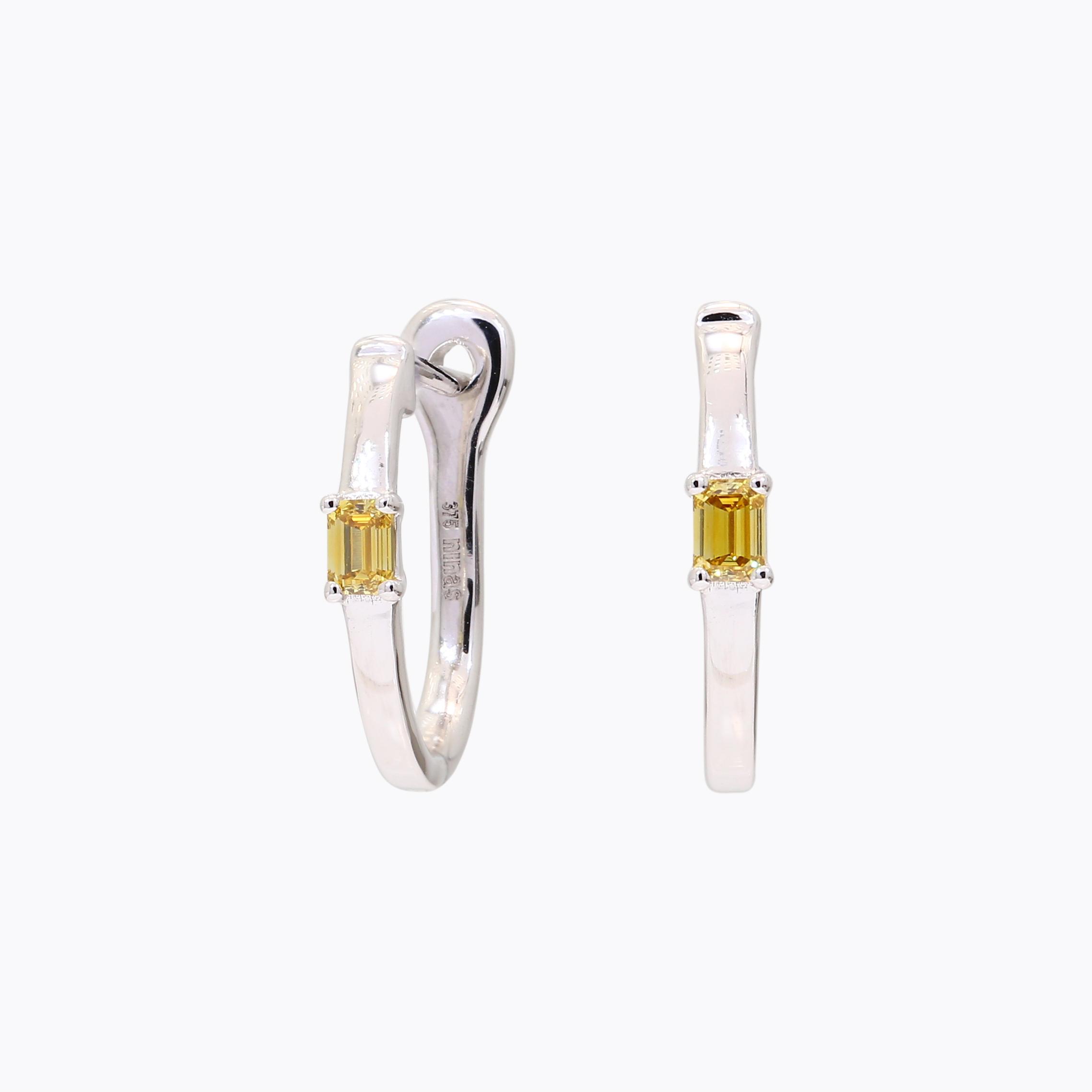 Figure emerald-cut yellow diamond huggie earrings