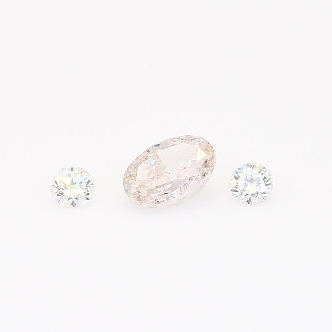 0.41 Total carat oval cut light pink and round cut white diamonds