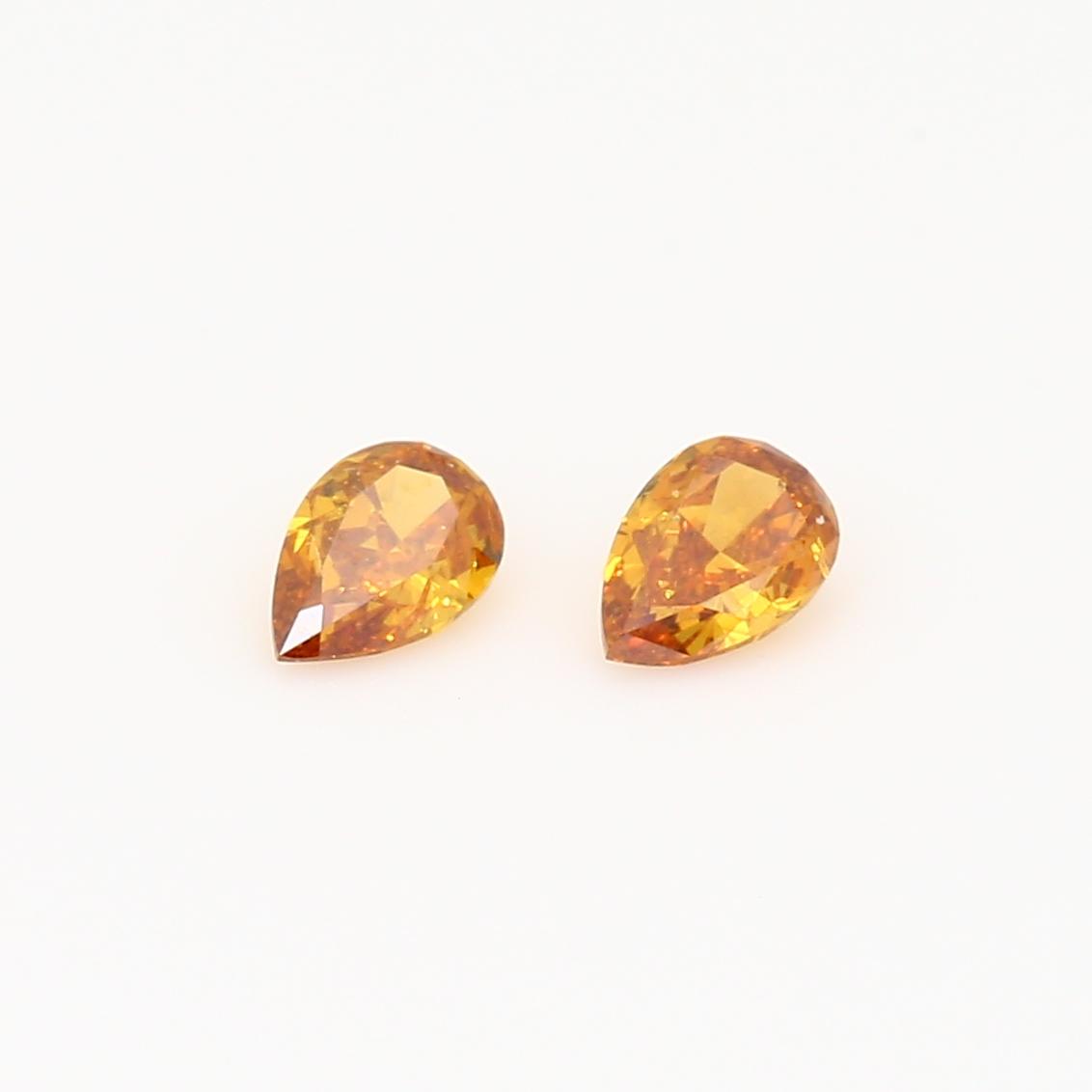 0.40 Total carat pair of pear-cut fancy intense orange diamonds