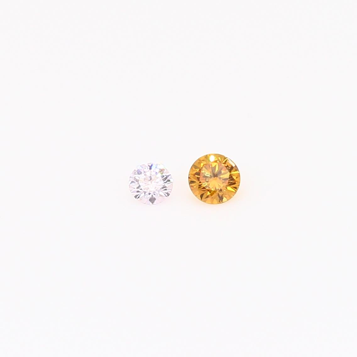 0.08 Total carat pair of round-cut light Argyle pink and fancy orange diamonds