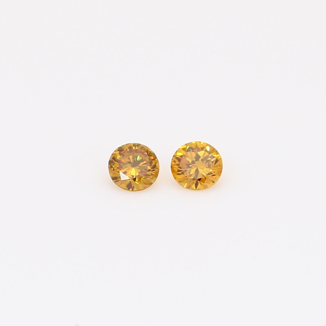 0.12 Total carat pair of round-cut fancy orange diamonds