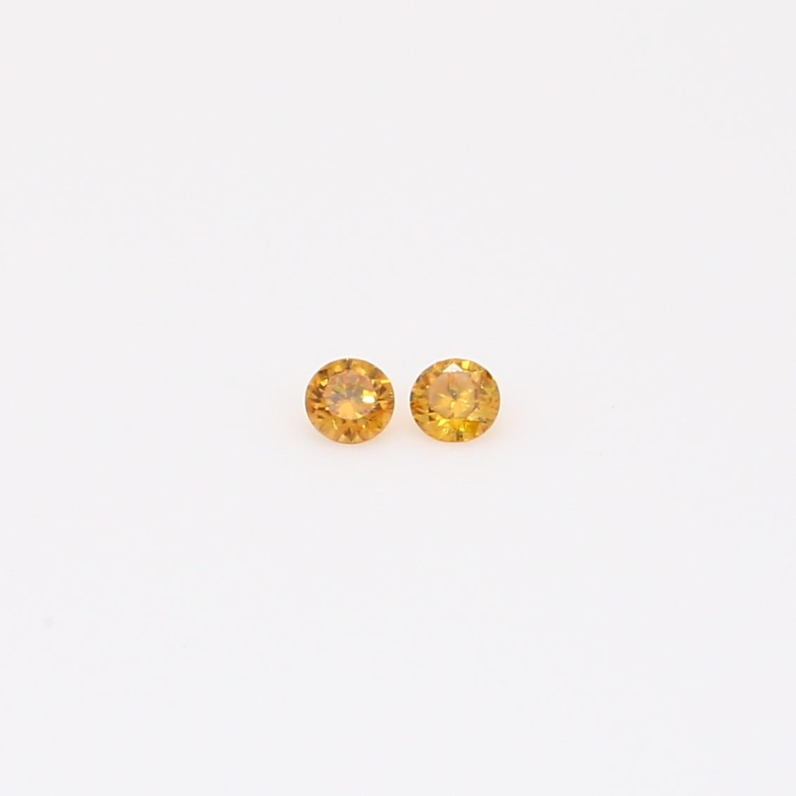 0.04 Total carat pair of round-cut fancy orange diamonds