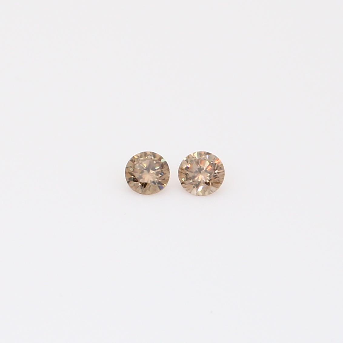 0.08 Total carat pair of round-cut champagne diamonds
