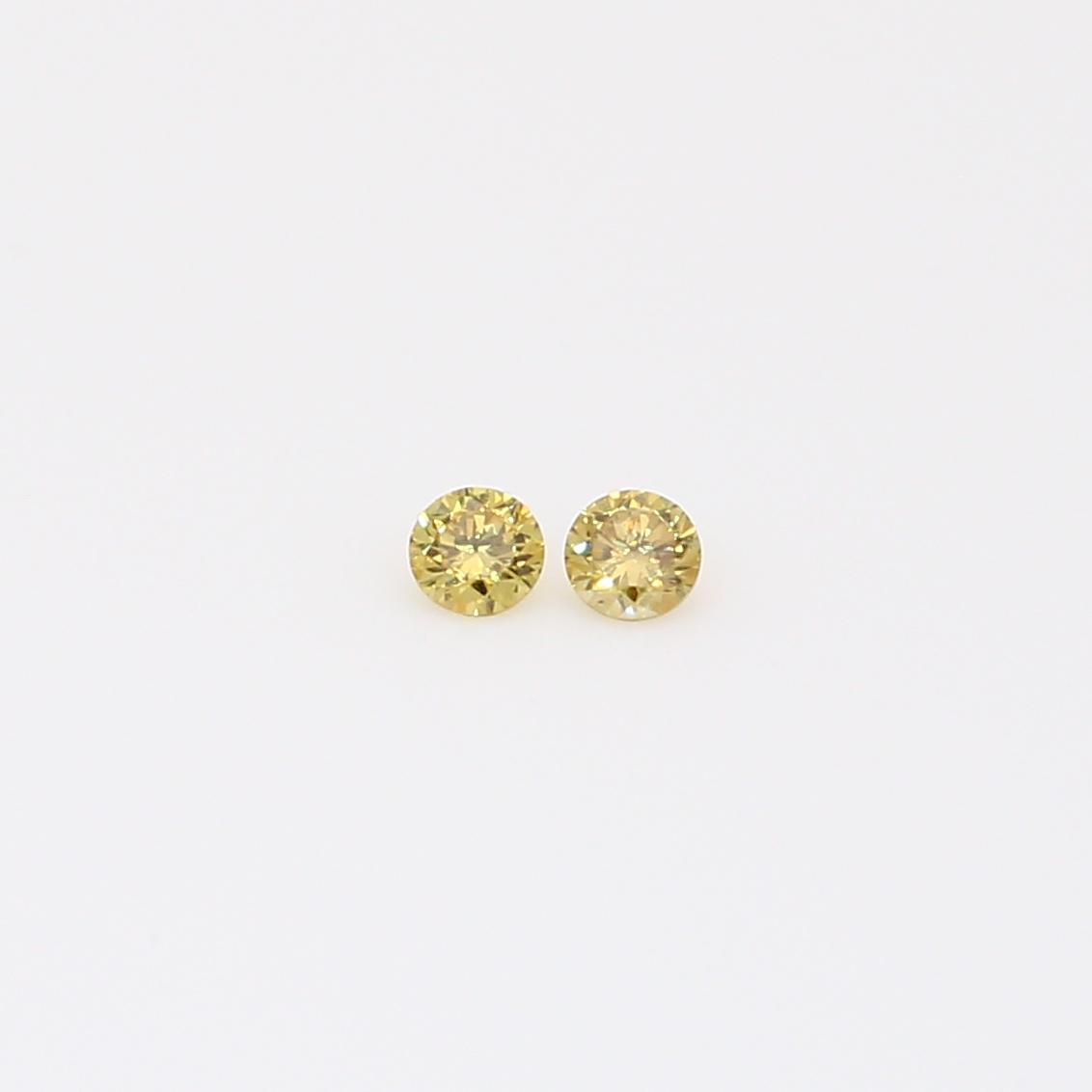 0.06 Total carat pair of round-cut fancy yellow diamonds