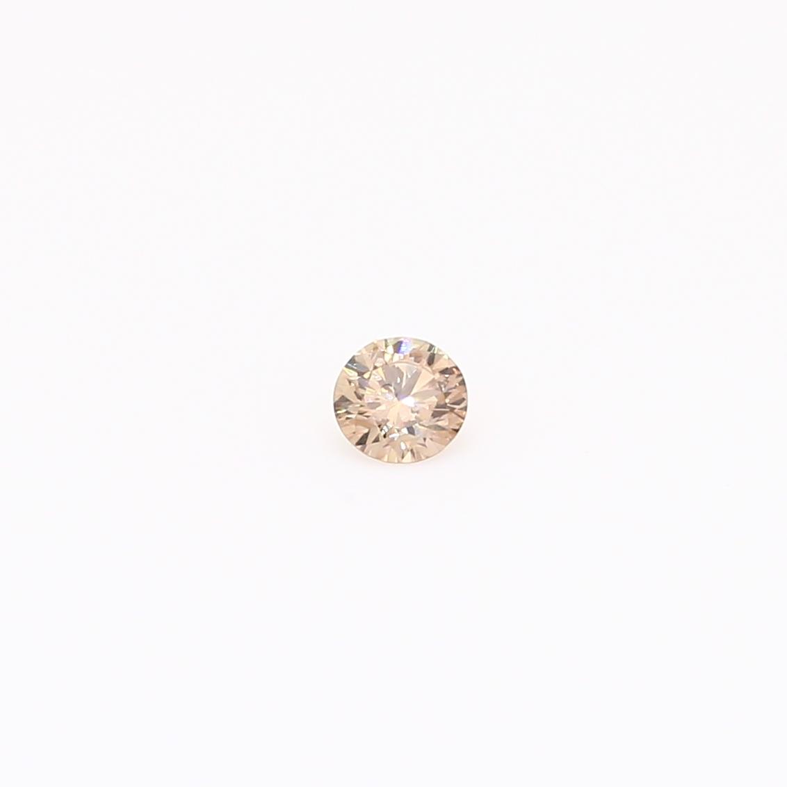 0.082 Carat round-cut champagne diamond