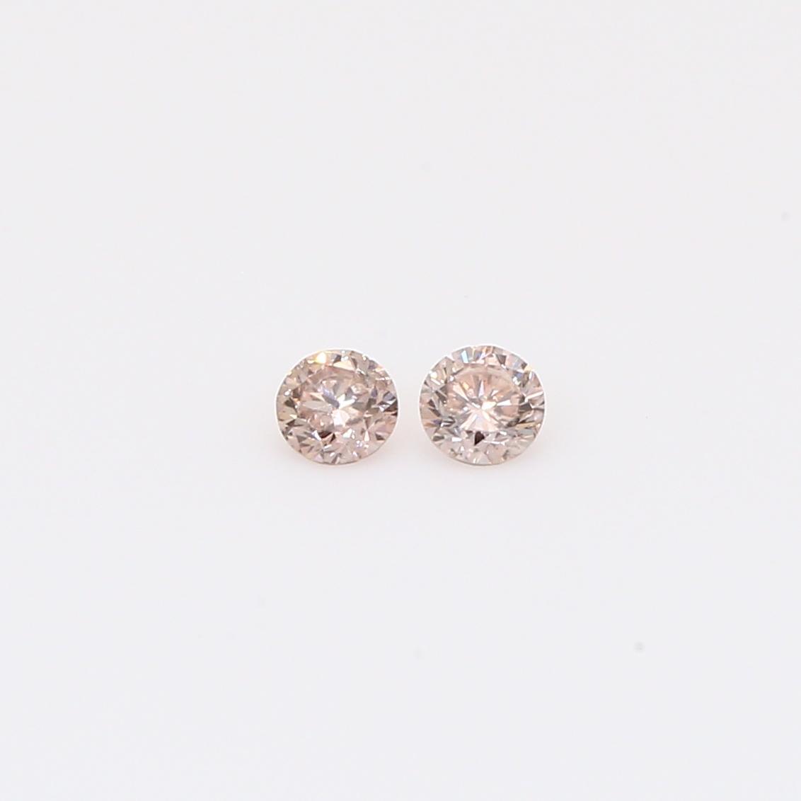 0.14 Total carat pair of round-cut intense pink champagne diamonds