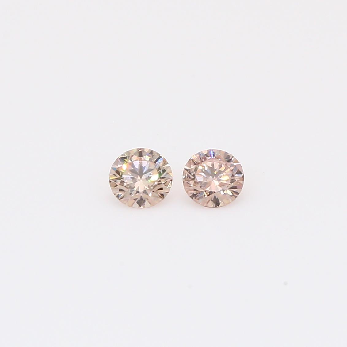 0.22 Total carat pair of round-cut intense pink champagne diamonds