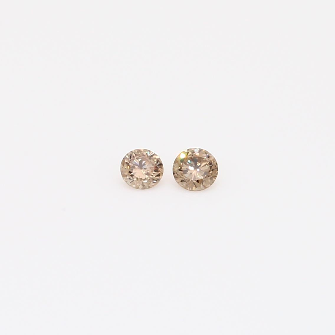 0.08 Total carat pair of round-cut champagne diamond