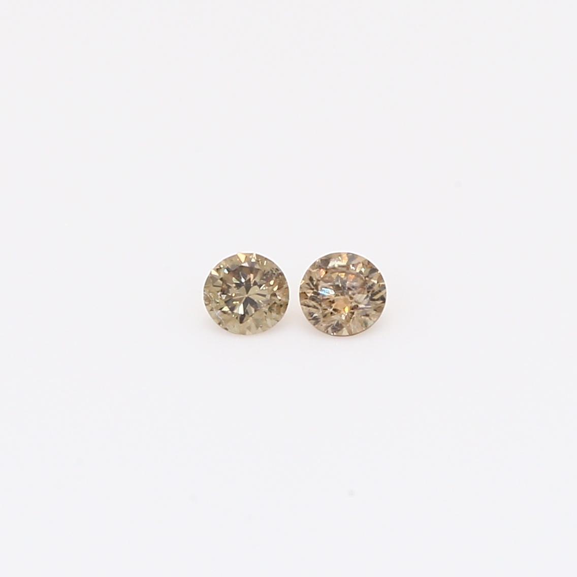 0.13 Total carat pair of round-cut champagne diamonds