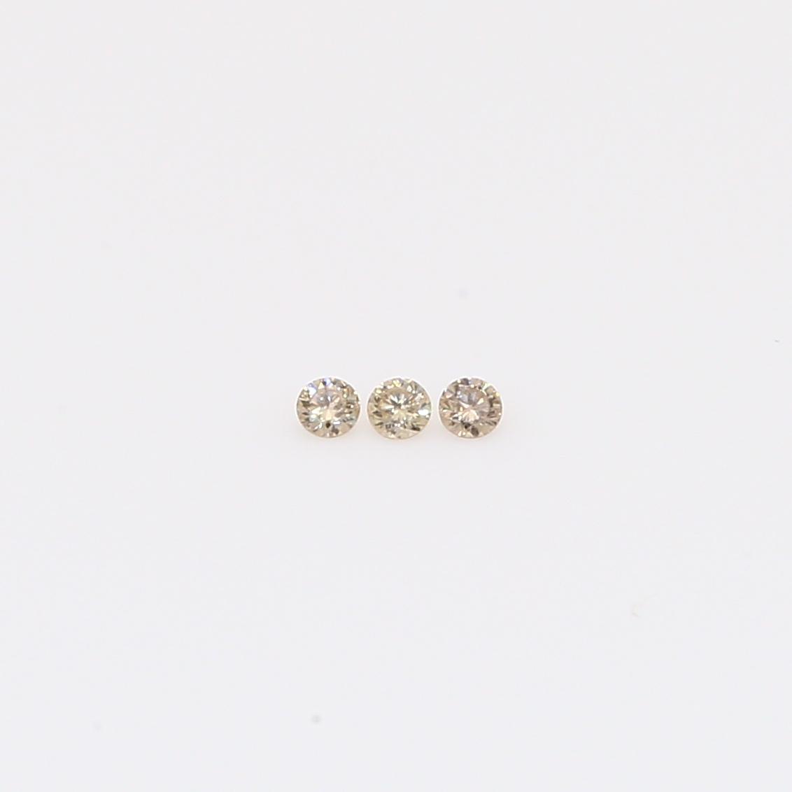 0.03 Total carat trio of round-cut champagne diamonds