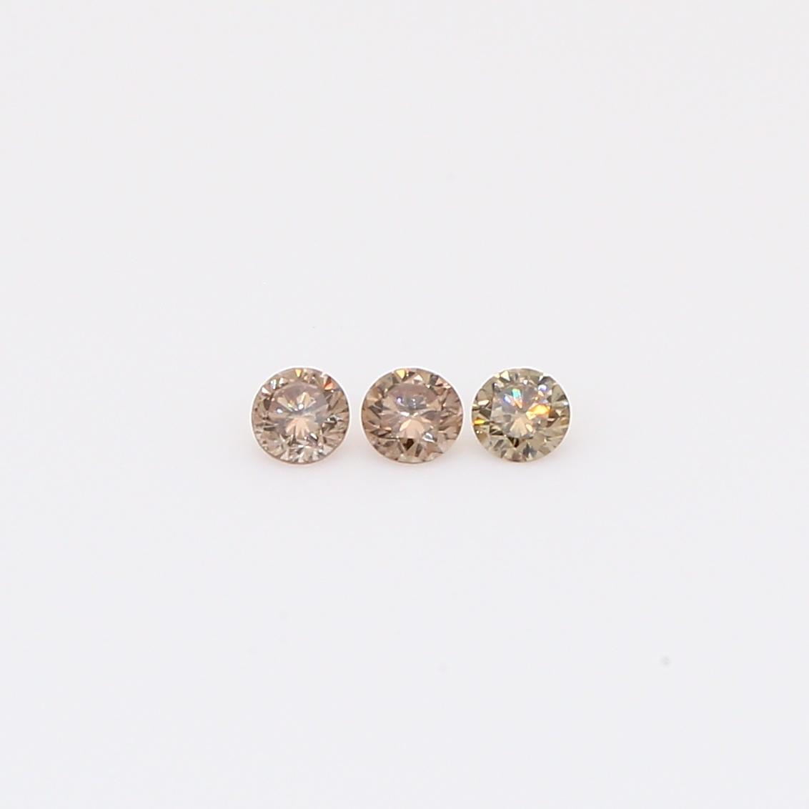 0.10 Total carat trio of round-cut champagne diamonds