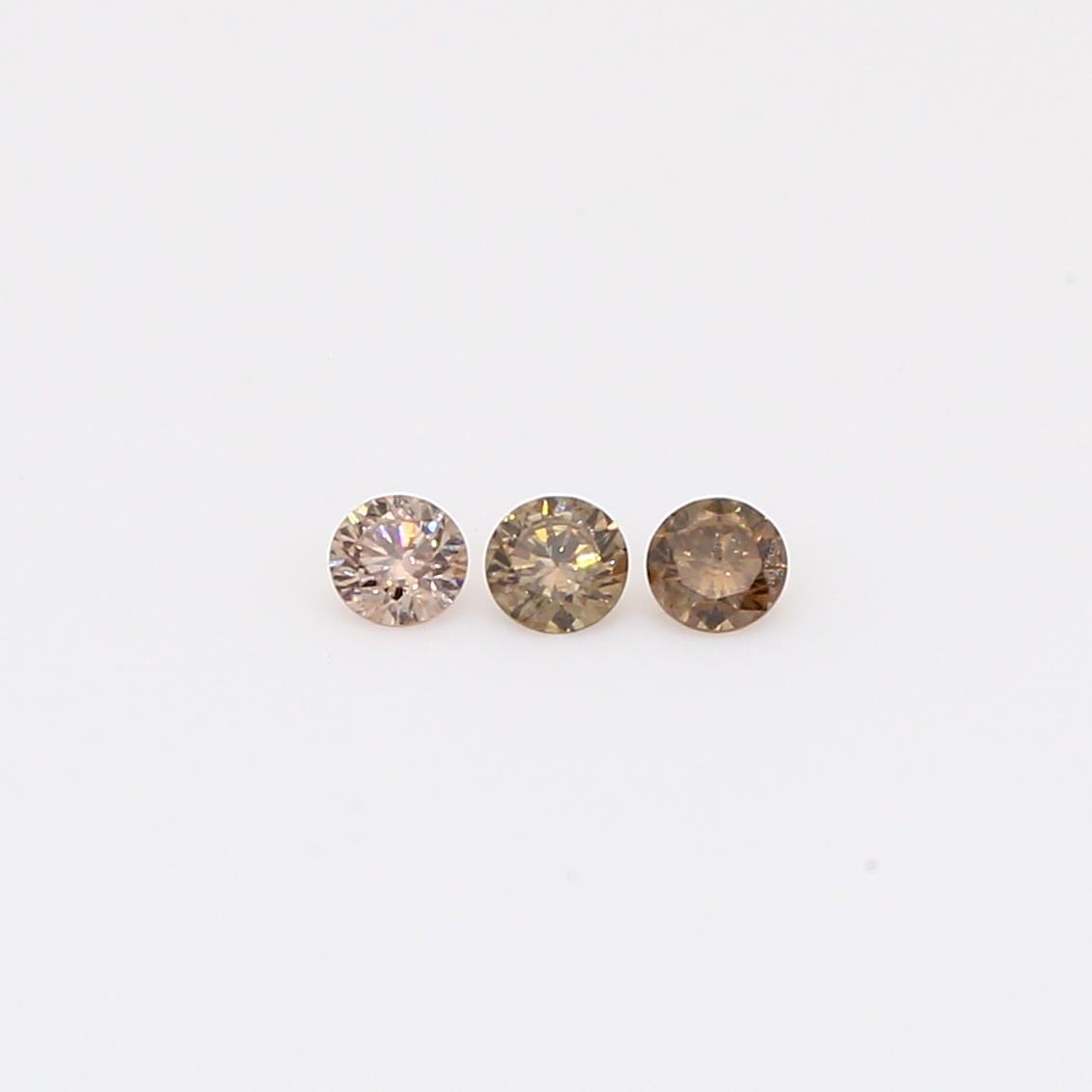 0.12 Total carat trio of round-cut champagne diamonds