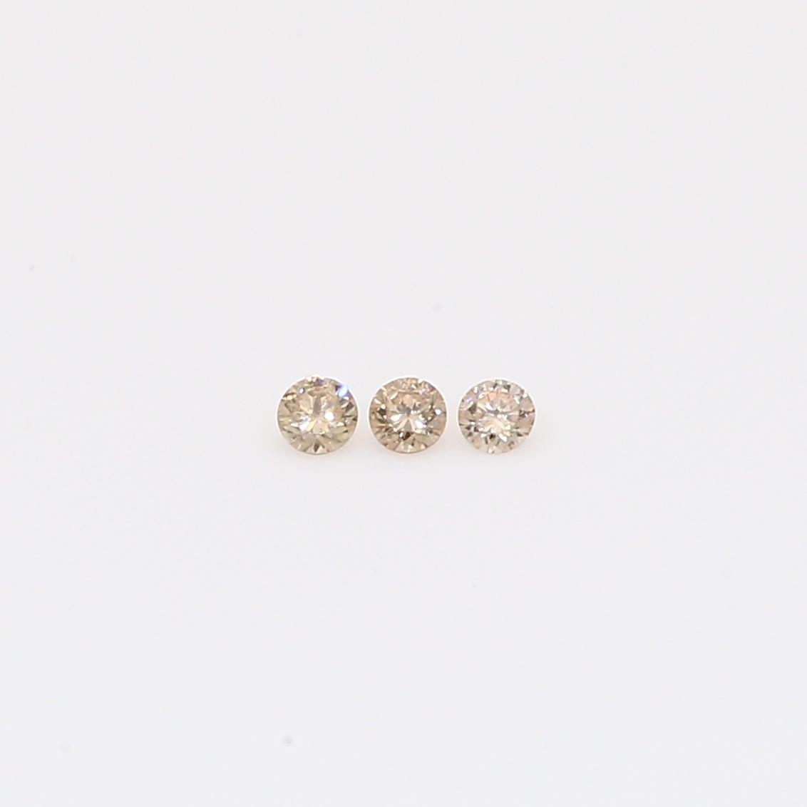 0.03 Total carat trio of champagne diamonds
