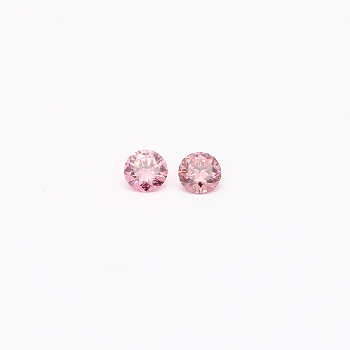 0.06 Total carat pair of round cut 2P Argyle pink diamonds