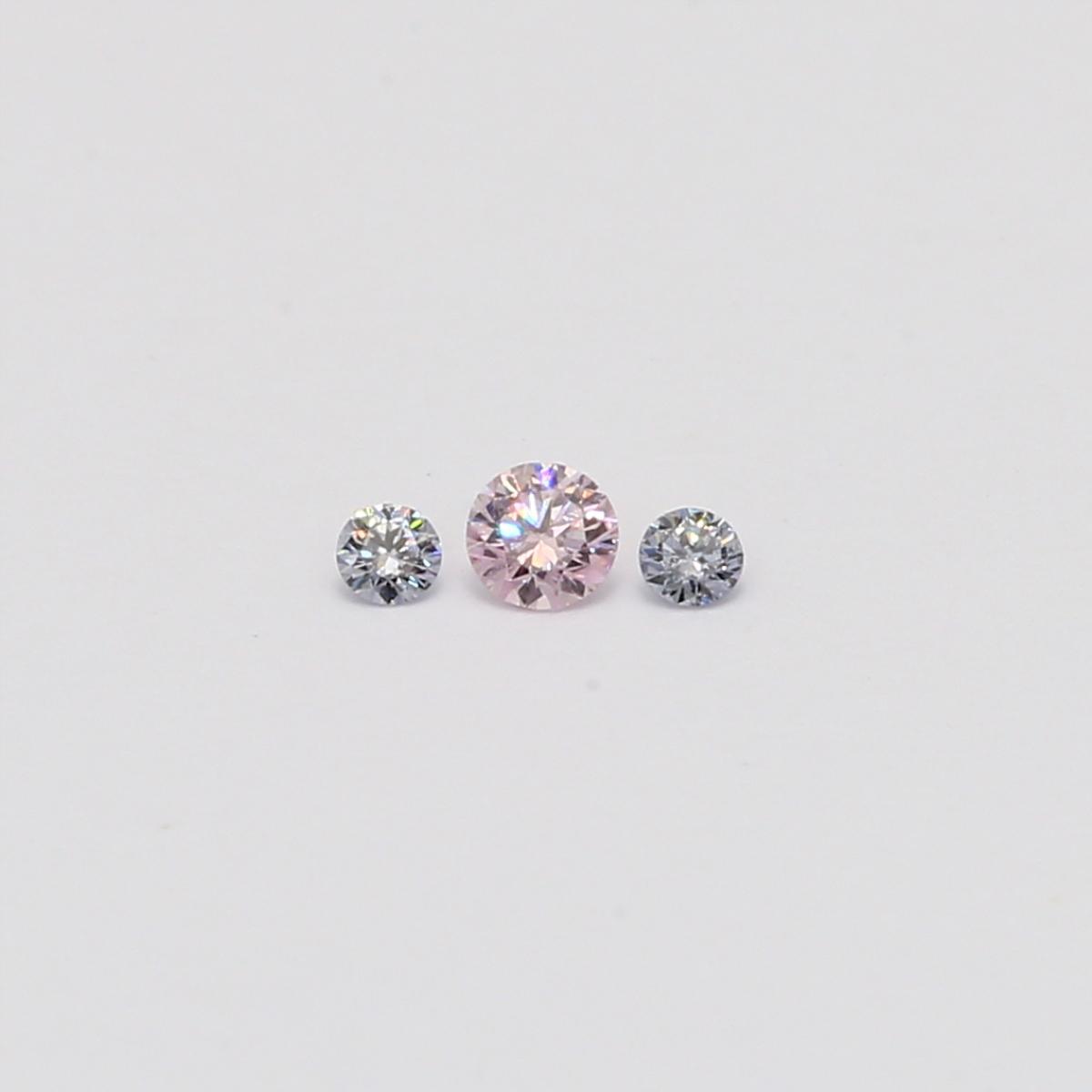 0.09 Total carat trio of round cut Argyle pink and blue diamonds