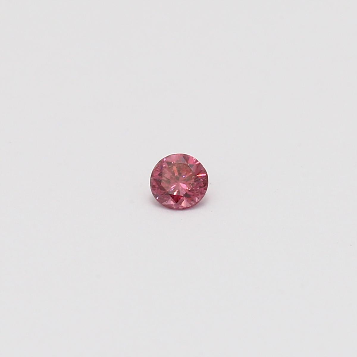 0.08 Carat round cut GIA certified fancy deep pink diamond