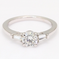 Daria round and tapered baguette cut white diamond 3 stone engagment ring